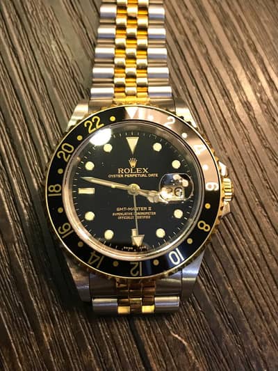 2005 Rolex GMT Master II Black and Gold Jubilee Bracelet