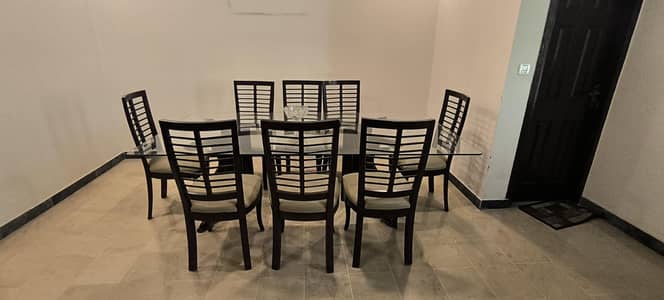 8 seater Glass Dinning Table with wooden chairs