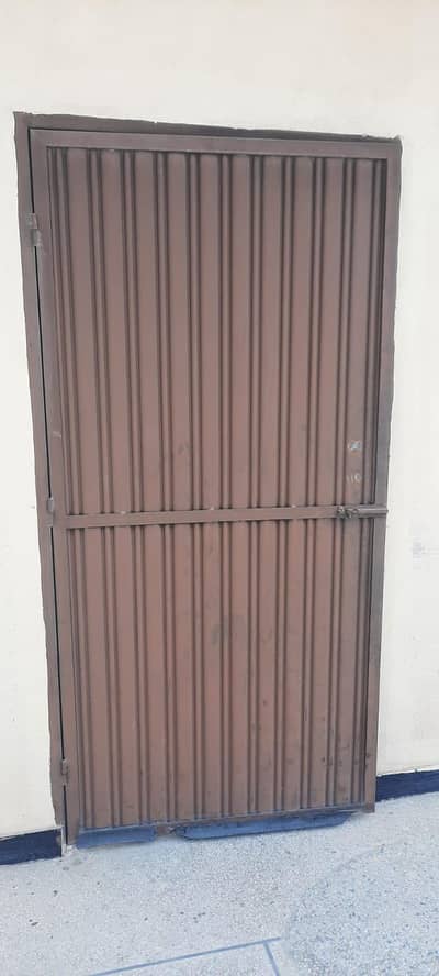 Iron door with frame and lock in good condition