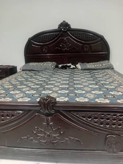 double size bed with two side tables