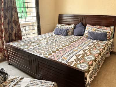 Bed with side tables