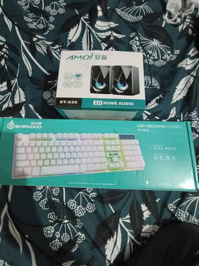 white RGB keyboard and speakers set for gaming pc