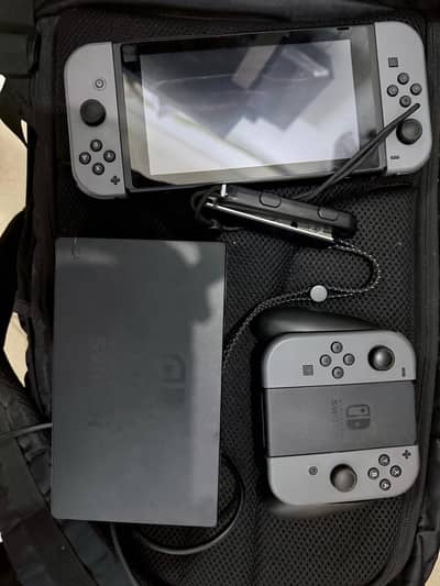 Nintendo Switch Console with Dock, Charger, Extra Joy-Cons & Grip