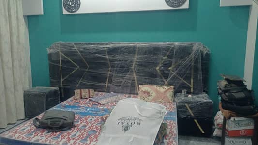 bed with 2 side table and dressing