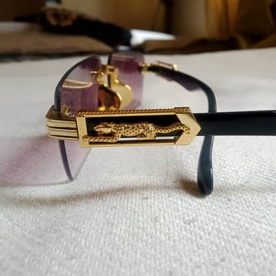 Watch is used. Glasses and chain are new