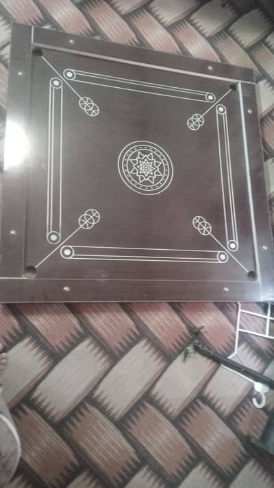 wooden board!"striker"! carrom men (coins) into corner pockets