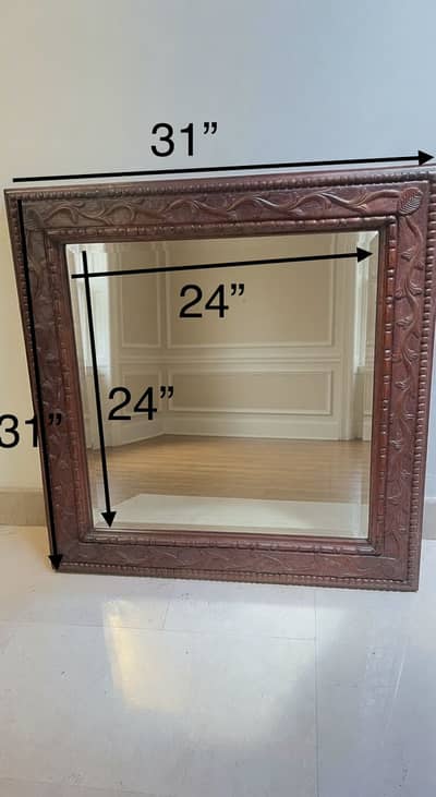 Mirror in hand carved wooden frame