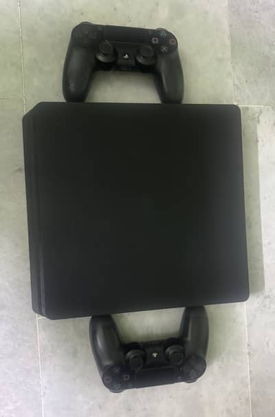 PS4 Slim 1TB with two original controllers & 7 exciting games