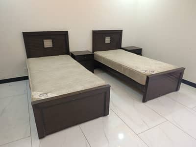 2 Single beds with mattress, side tables, and dressing