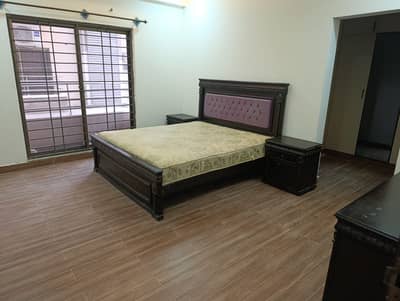 Double bed with mattress, 2 side tables, dressing.