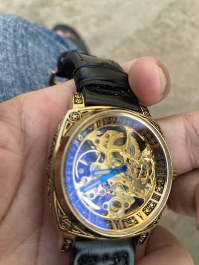 Luxury Skeleton Mechanical Watch – Golden Dial & Leather Strap