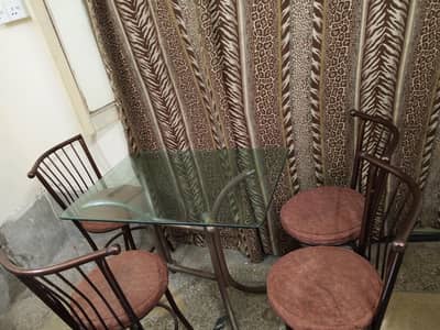Dining table with cushion chairs