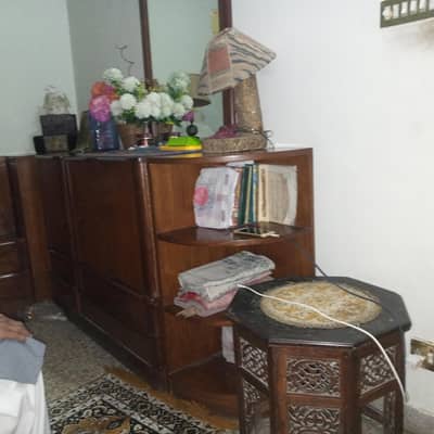 Double bed with side cabinets.