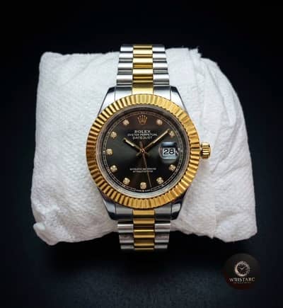 Gold Fluted Bezel. Black Diamond Dial. Two-Tone Silver & Gold Bracelet