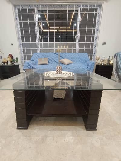 wooden central table with thick glass