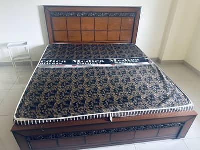 Double bed with mattress, 1.8m wide and 2m long.