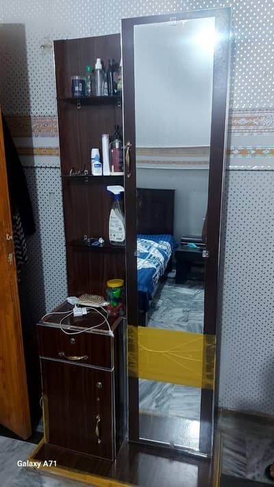 center glass top table with 2 side tables and a dressing table.