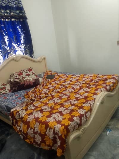 White wooden bed