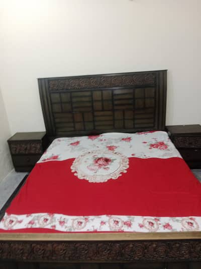 double bed with side tables and dressing