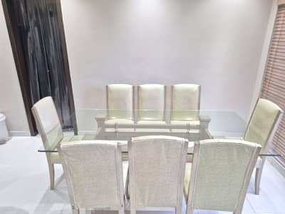 Wooden dining table and 8 chairs