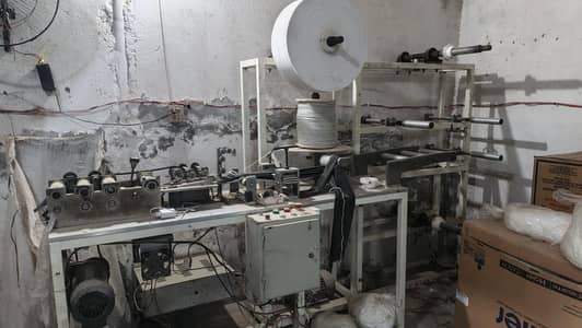 Disposable face mask machine