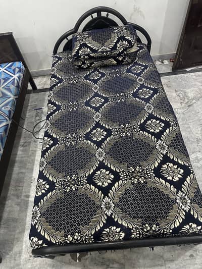 Comfortable student bed black colour with design
