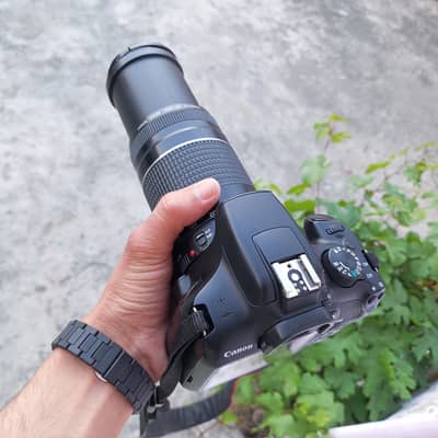 Canon 1300d with 75-300mm lens 2 battery's bag neck strip