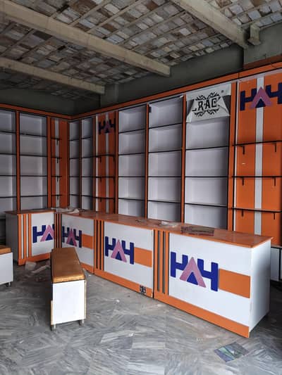 Premium clothing store fixtures: counters, tables, and benches.