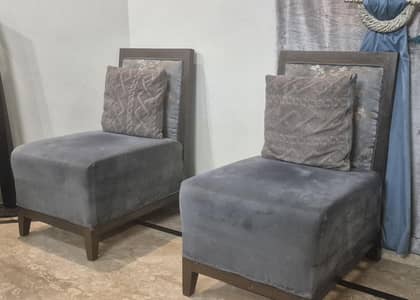 pair of single seater sofas