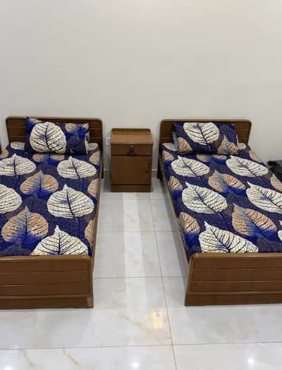 2 Single Bed with mattresses and 1 side table