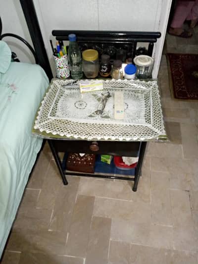 2 single iron beds,1 side table, dressing rack