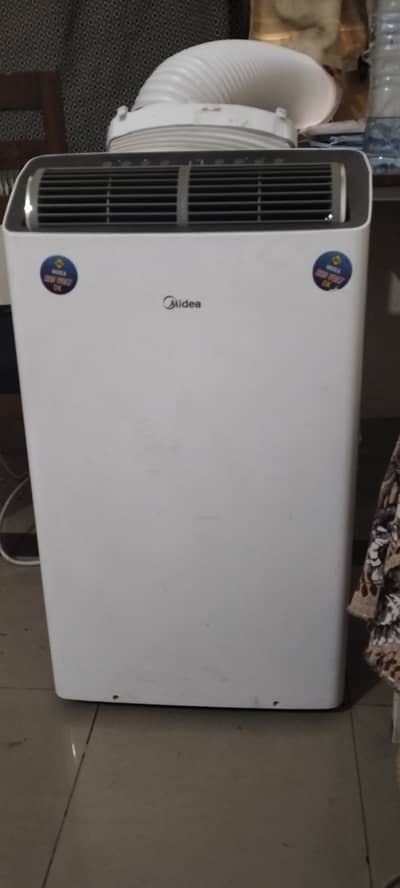 Midea portable Ac in very good condition . used only for few months .