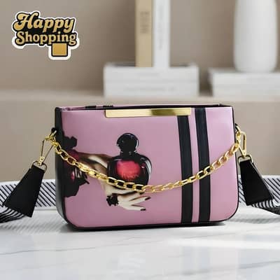 products pink canvas crossbody bag with perfume bottle print and chain