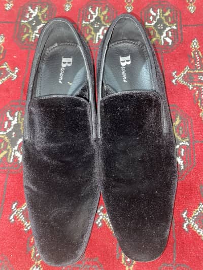 Pair of leather shoes of B MEN’s company