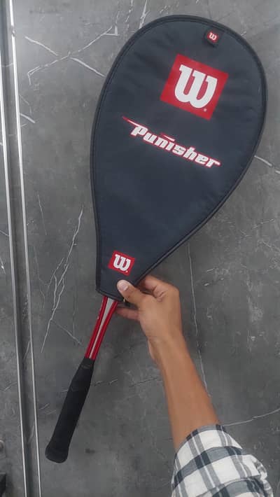 Wilson punisher squash racket.