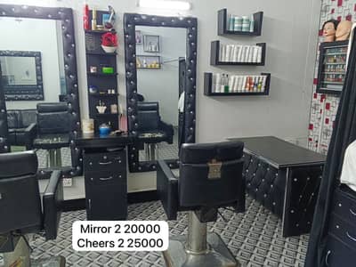 Saloon chairs mirror cash counter etc.