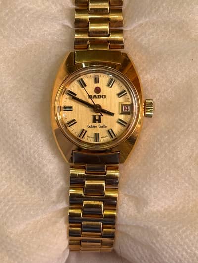 Rado golden castle ladies watch, champagne dial, Swiss made.