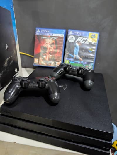 PS4 Pro 1TB with two Game discs and two controllers