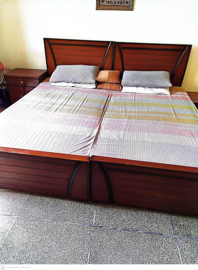 Two Wooden single beds with center table