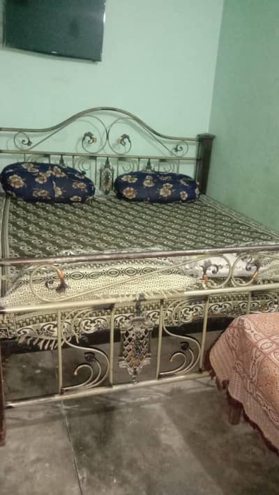 wood and iron bed