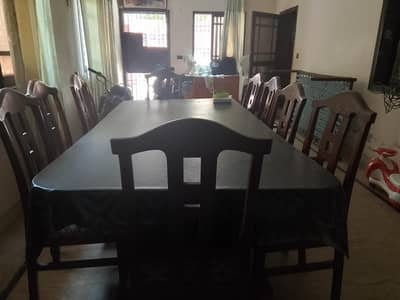 dinning table 10 by 10 ,10 chairs ,good condition urgent 60k