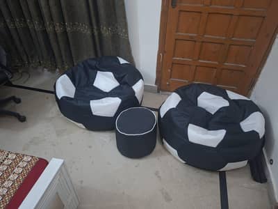 2 bean bags football themed with one table