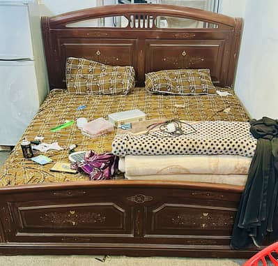 Wood bed with mattress and side table