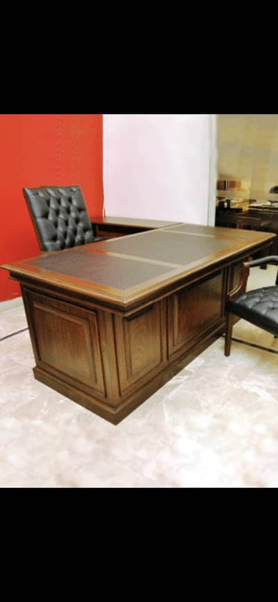 Executive wooden table is available for sale