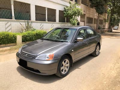 Honda Civic EXi 2003. . Beige Interior. . Original Paint. . One of Its Kind.