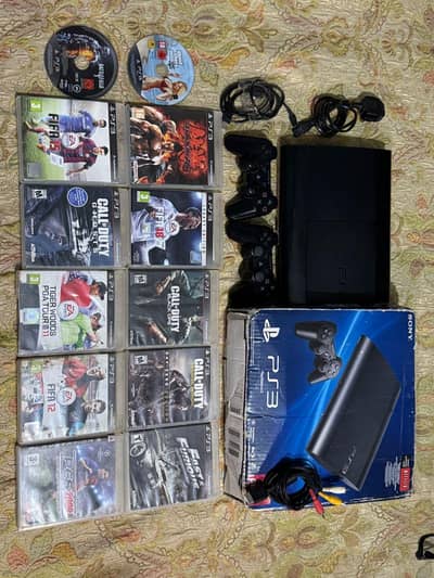 Brand New PS3 with box and 12 games and 2 Contrllrs 10/10 condition