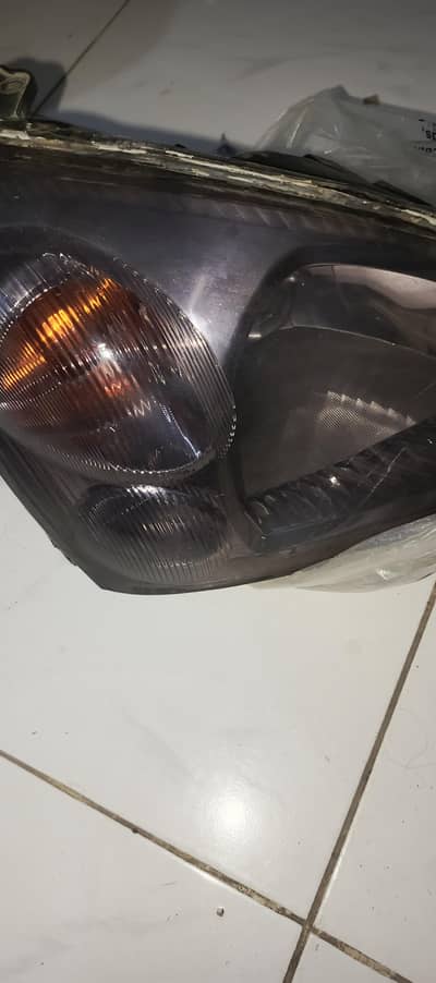 suzuki liana headlights pear