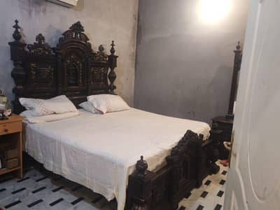 solid wooden bed with side tables . . dressing table and wooden tables
