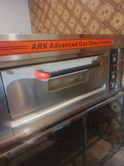 pizza oven and counter and pizza cutter