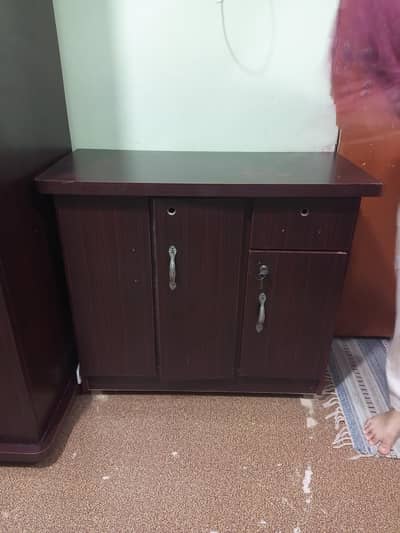 urgent table sale brown cabinet